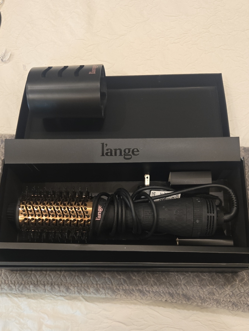 Lange black and gold styling tool